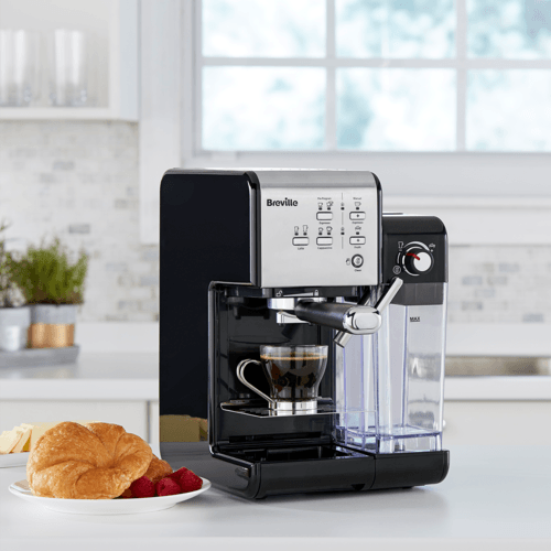 espressor prima latte 2 negru pe masa